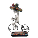 Ciclista catrina - Statue von La Catrina auf einem Fahrrad